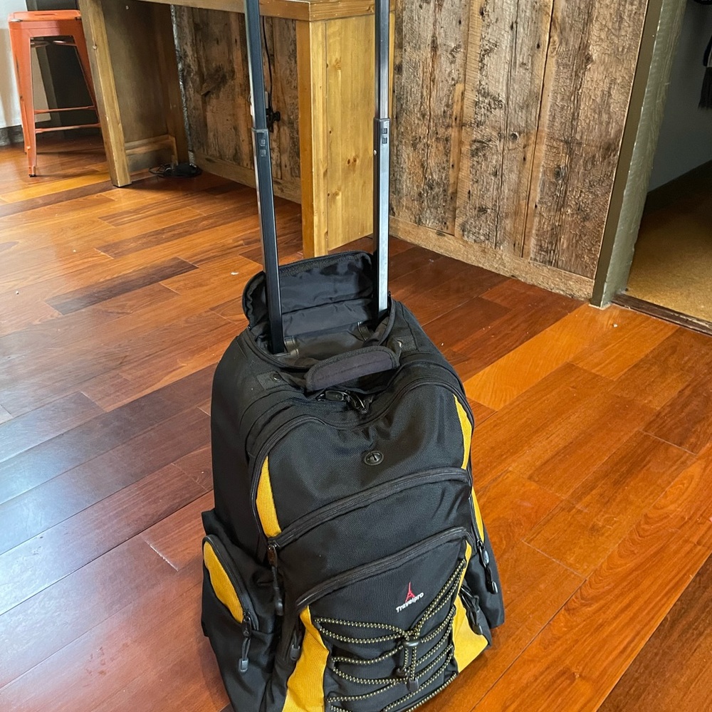 TravelPro T-Pro rolling carry-on, approved backpack.